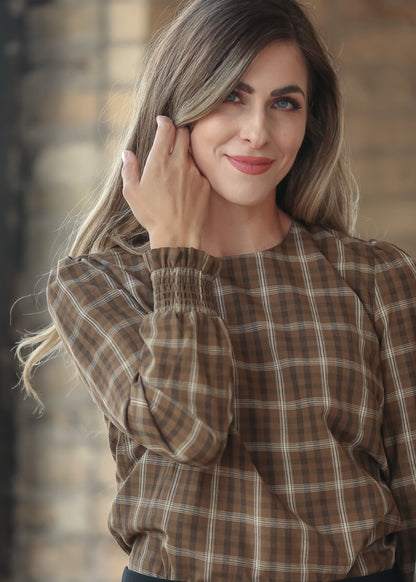 Close-up of Blake brown plaid top showing the square neckline and woven cotton pattern.