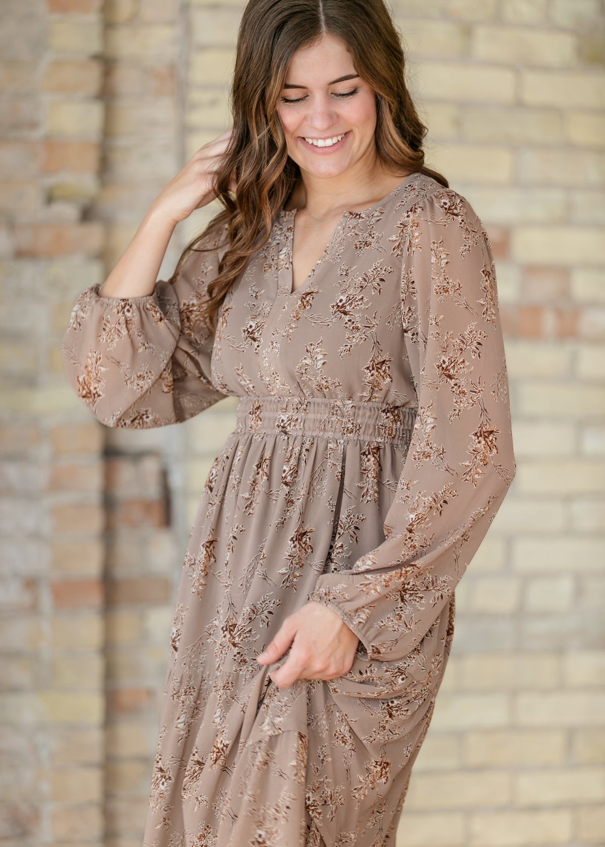 Celia brown floral maxi dress showing the V-neck bodice, floral print, and gathered waist.