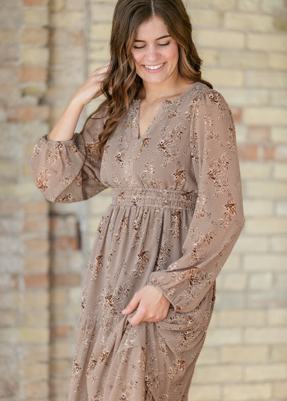 Celia brown floral maxi dress showing the V-neck bodice, floral print, and gathered waist.