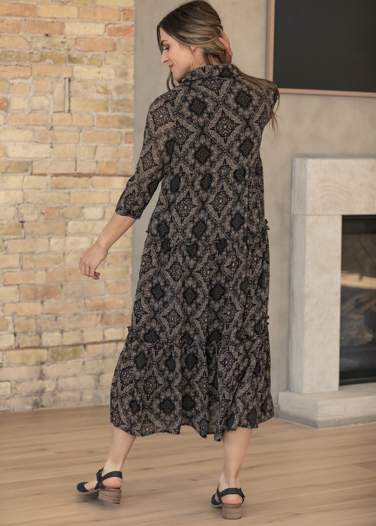 Elsie button front midi dress styled indoors with a calf-length tiered hem.