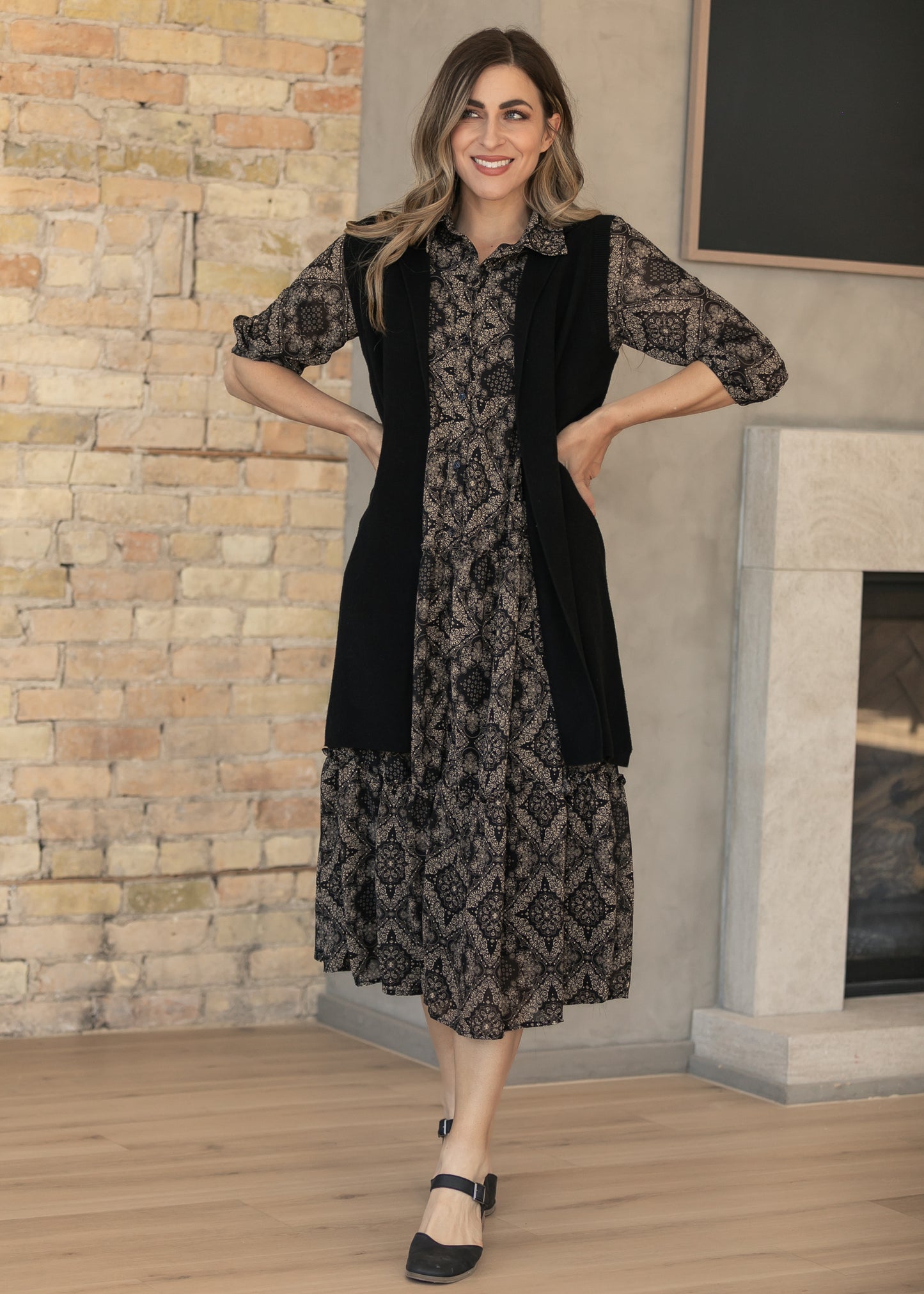 Black and cream paisley midi dress showing the flowing A-line silhouette.