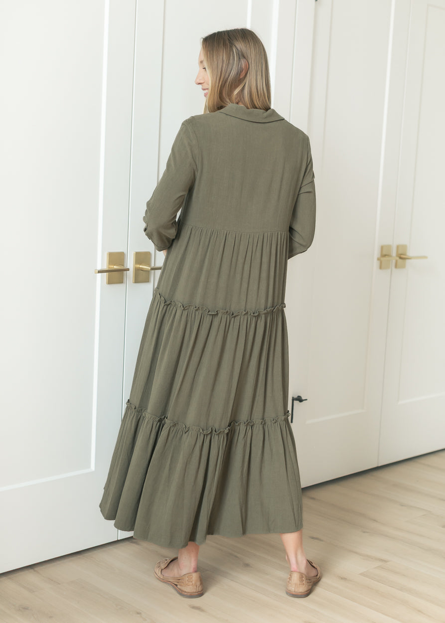 Back of olive Elsie midi dress showing the relaxed tiered skirt and half sleeves.