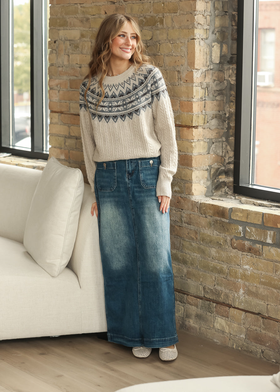 Full-length model view of cream Fair Isle knit sweater with a long denim skirt