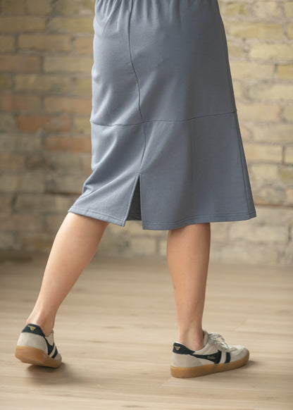 Close up of the Gracie Dusty Blue Midi Sweatshirt Skirt showing the back slit and soft sweatshirt inspired fabric