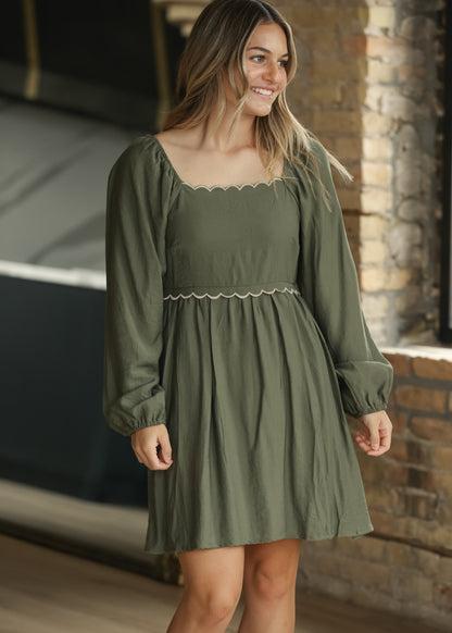 Winter sage dress with square neckline, scalloped trim, long sleeves, and gathered skirt.