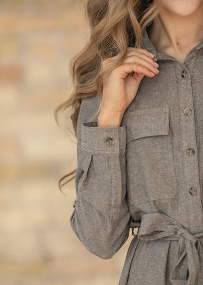 Close-up of sleeve of brown chambray dress.