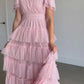 A wrap swiss dot tulle midi dress in blush pink.