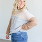 A colorblocked lightweight hoodie with ribbed texture.