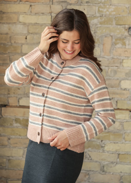 Close-up of striped knit cardigan showing button-front detail and ribbed trim