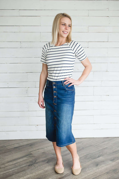 Modest women's denim midi skirt. Four buttons down the front, also pockets front and back.