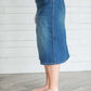 Modest women's denim midi skirt. Four buttons down the front, also pockets front and back.