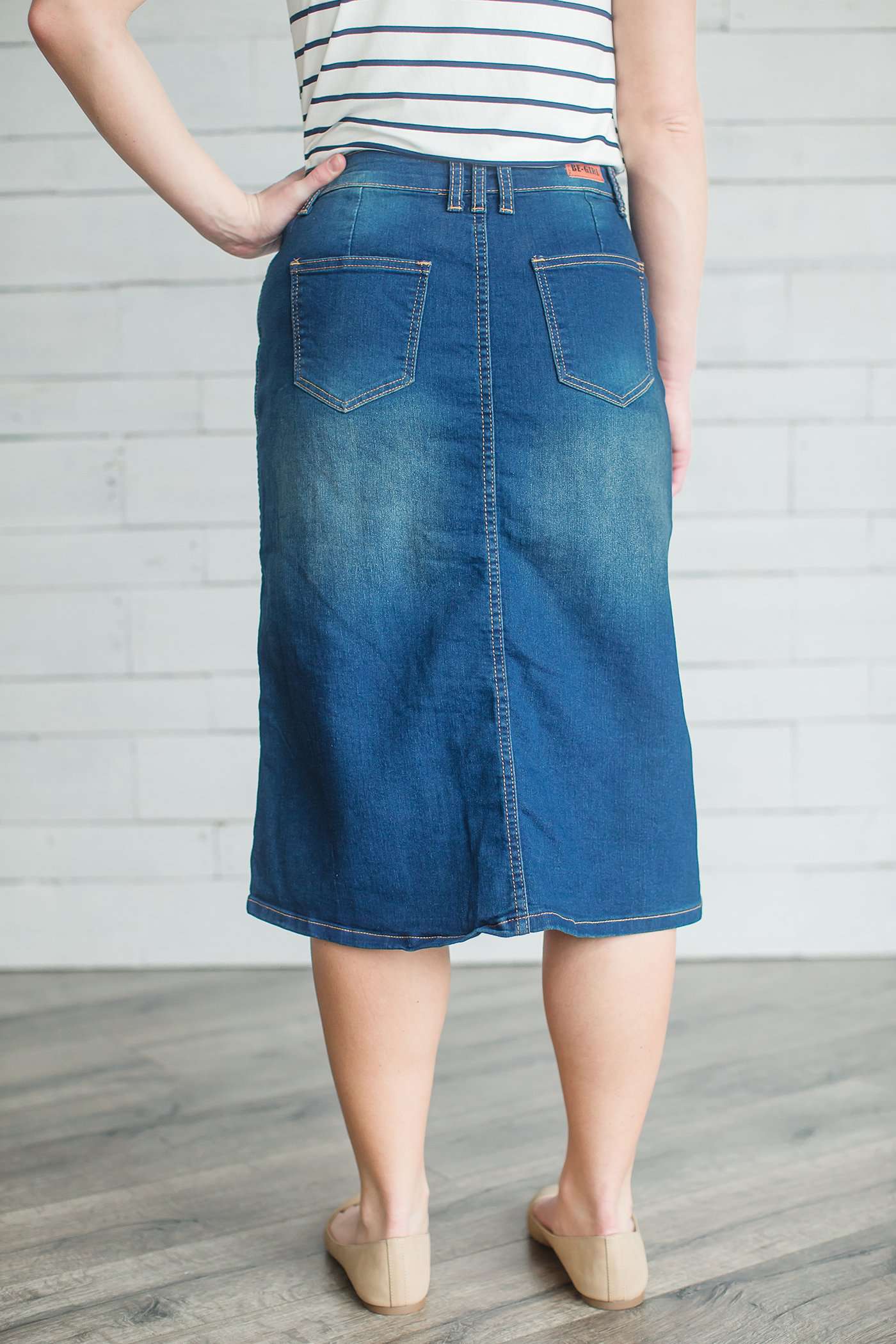 Modest women's denim midi skirt. Four buttons down the front, also pockets front and back.