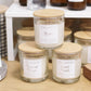 hand poured soy candles in a clear jar with bamboo lid