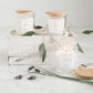 hand poured soy candles in a clear jar with bamboo lid