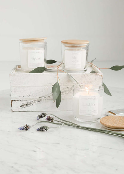 hand poured soy candles in a clear jar with bamboo lid