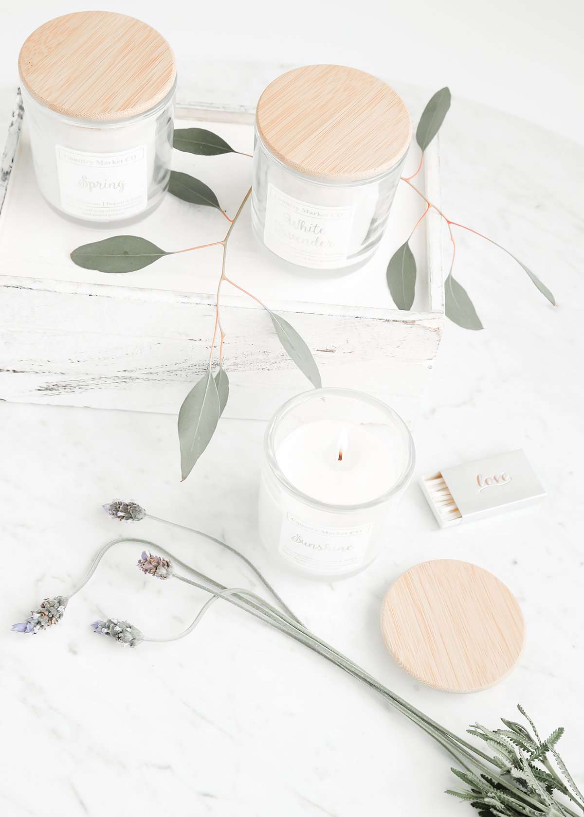 hand poured soy candles in a clear jar with bamboo lid