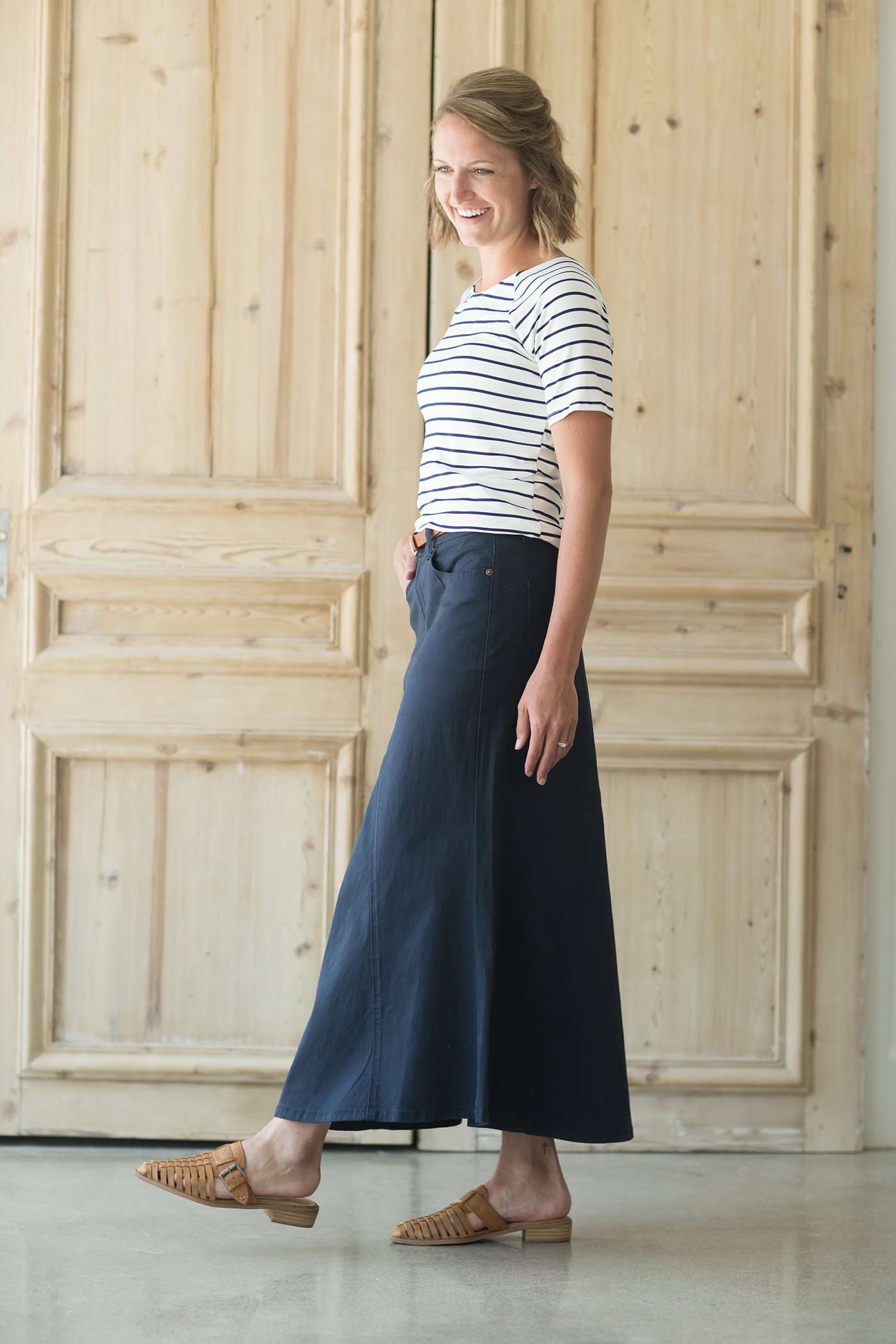 Shop this long, modest navy skirt with a beautiful a-line insert.
