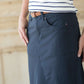 Shop this long, modest navy skirt with a beautiful a-line insert.