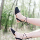 Black ankle wrap sandal with closed-toe and strap back open-heel.