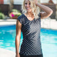 Women's modest cap sleeve swim suit top, black with white polka dots.
