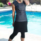 Women's modest cap sleeve swim suit top, black with white polka dots.