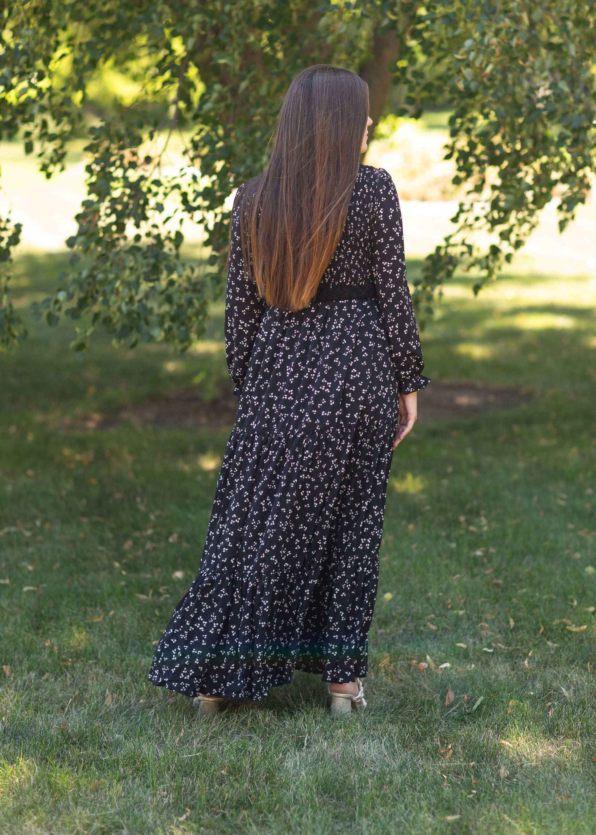 An Inherit Exclusive, the Aurora Floral Long Sleeve Maxi Dress is a fully lined true maxi dress we know you're going to love! This dress comes in either a black or ivory base with an allover floral pattern. The skirt has subtle tiers and the ruffle detail on the sleeves add a touch of flair. The smocked bodice in very comfortable and the modest v-neck adds a feminine touch!