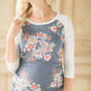 Maternity gathered sides on this navy floral top with light grey 3/4 length sleeves.