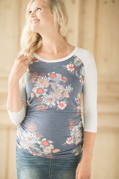 Maternity gathered sides on this navy floral top with light grey 3/4 length sleeves.