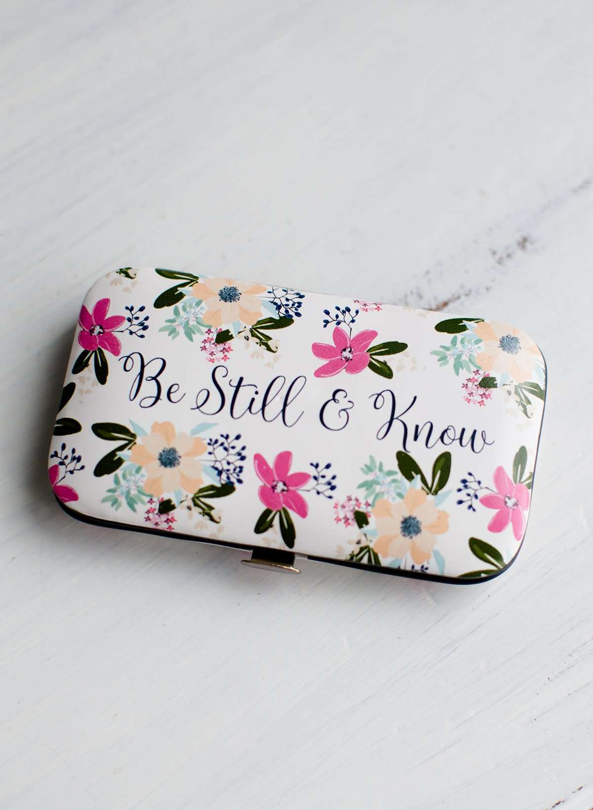 Floral padded manicure case that says be still in know.