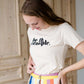 be the example cream colored graphic tee
