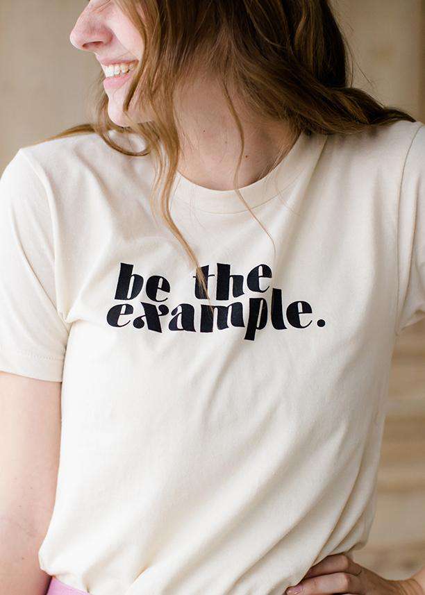 be the example cream colored graphic tee