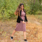 This is a Cinch Waist Athletic midi dress in a purpley taupe color that has a mesh detail and large side pockets. 