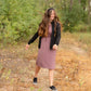 This is a Cinch Waist Athletic midi dress in a purpley taupe color that has a mesh detail and large side pockets. 
