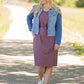 This is a Cinch Waist Athletic midi dress in a purpley taupe color that has a mesh detail and large side pockets. 