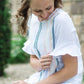Modest white belle-sleeve top with Earthy colored embroidery down the front.