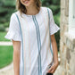 Modest white belle-sleeve top with Earthy colored embroidery down the front. 