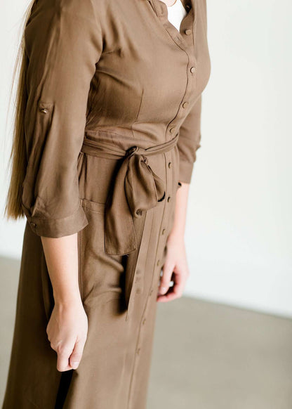 Olive colored belted midi dress with buttons running down the front.