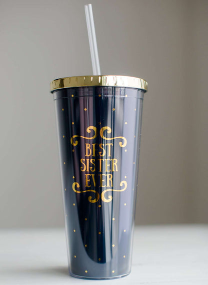 Navy tumbler with gold polka dots that says best sister ever.