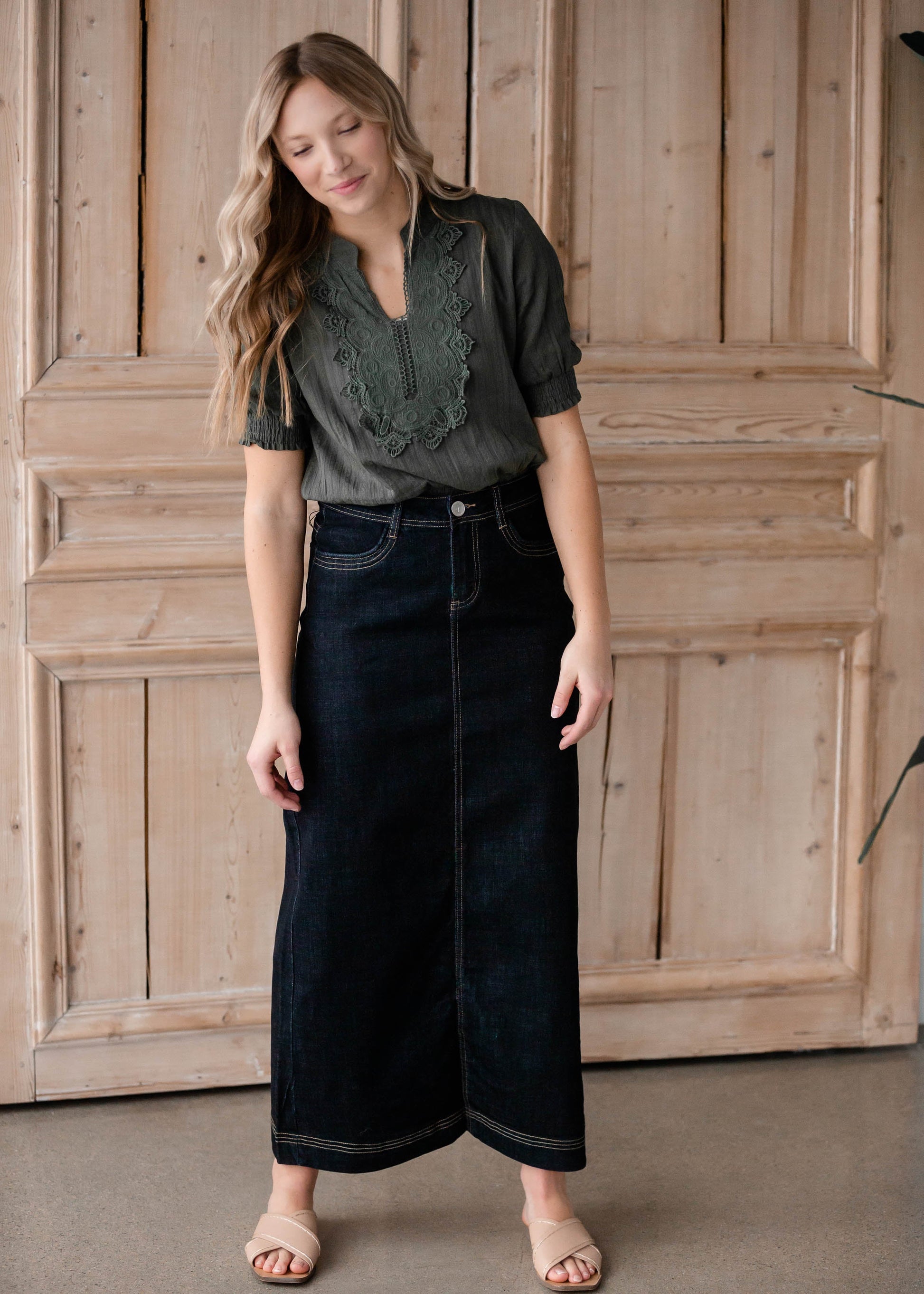 The Beth Dark Wash Long Denim Skirt is an Inherit Design made with you in mind! The dark wash is easy to dress up and details make this a stand out skirt! There is a triple stitch detail on the bottom hem and an Inherit logo patch on the back waistband! A straight fit with a slit in the back makes this long denim skirt super easy to move in and to pair with any tops!
