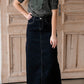 The Beth Dark Wash Long Denim Skirt is an Inherit Design made with you in mind! The dark wash is easy to dress up and details make this a stand out skirt! There is a triple stitch detail on the bottom hem and an Inherit logo patch on the back waistband! A straight fit with a slit in the back makes this long denim skirt super easy to move in and to pair with any tops!