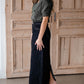 The Beth Dark Wash Long Denim Skirt is an Inherit Design made with you in mind! The dark wash is easy to dress up and details make this a stand out skirt! There is a triple stitch detail on the bottom hem and an Inherit logo patch on the back waistband! A straight fit with a slit in the back makes this long denim skirt super easy to move in and to pair with any tops!