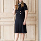 modest black midi dress with gold button accent