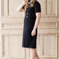 modest black midi dress with gold button accent
