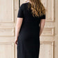 modest black midi dress with gold button accent
