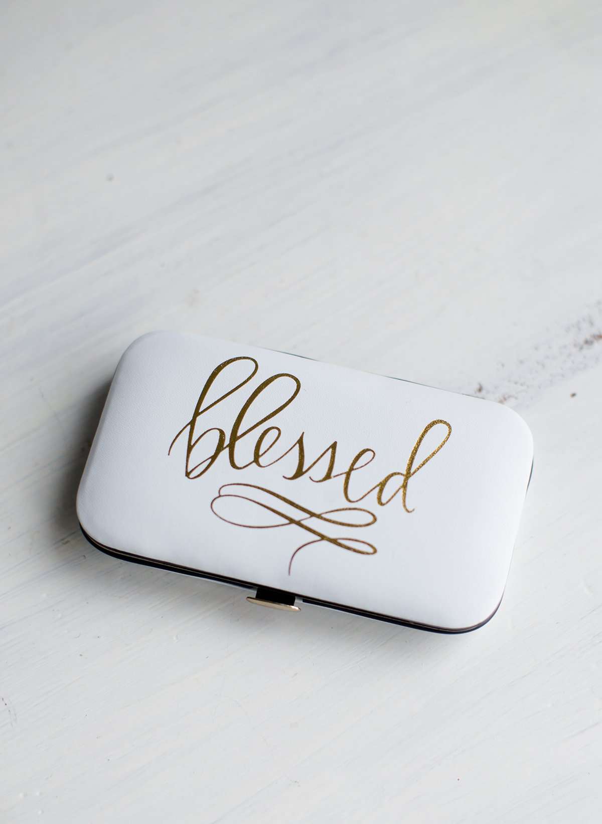 White padded manicure case with a blessed gold foil print