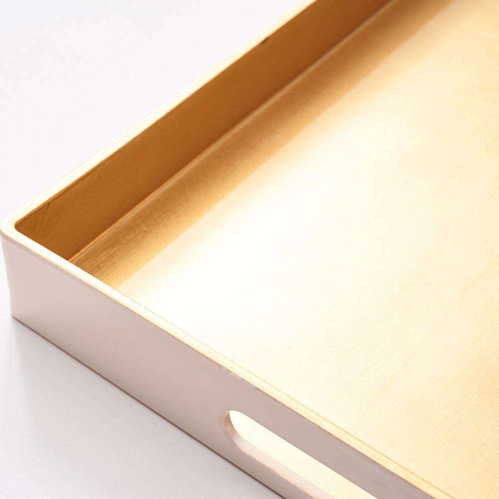 Blush organization tray with gold lining.