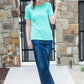 Modest boat-neck and raglan sleeve tee in mauve or teal with white horizontal stripes.
