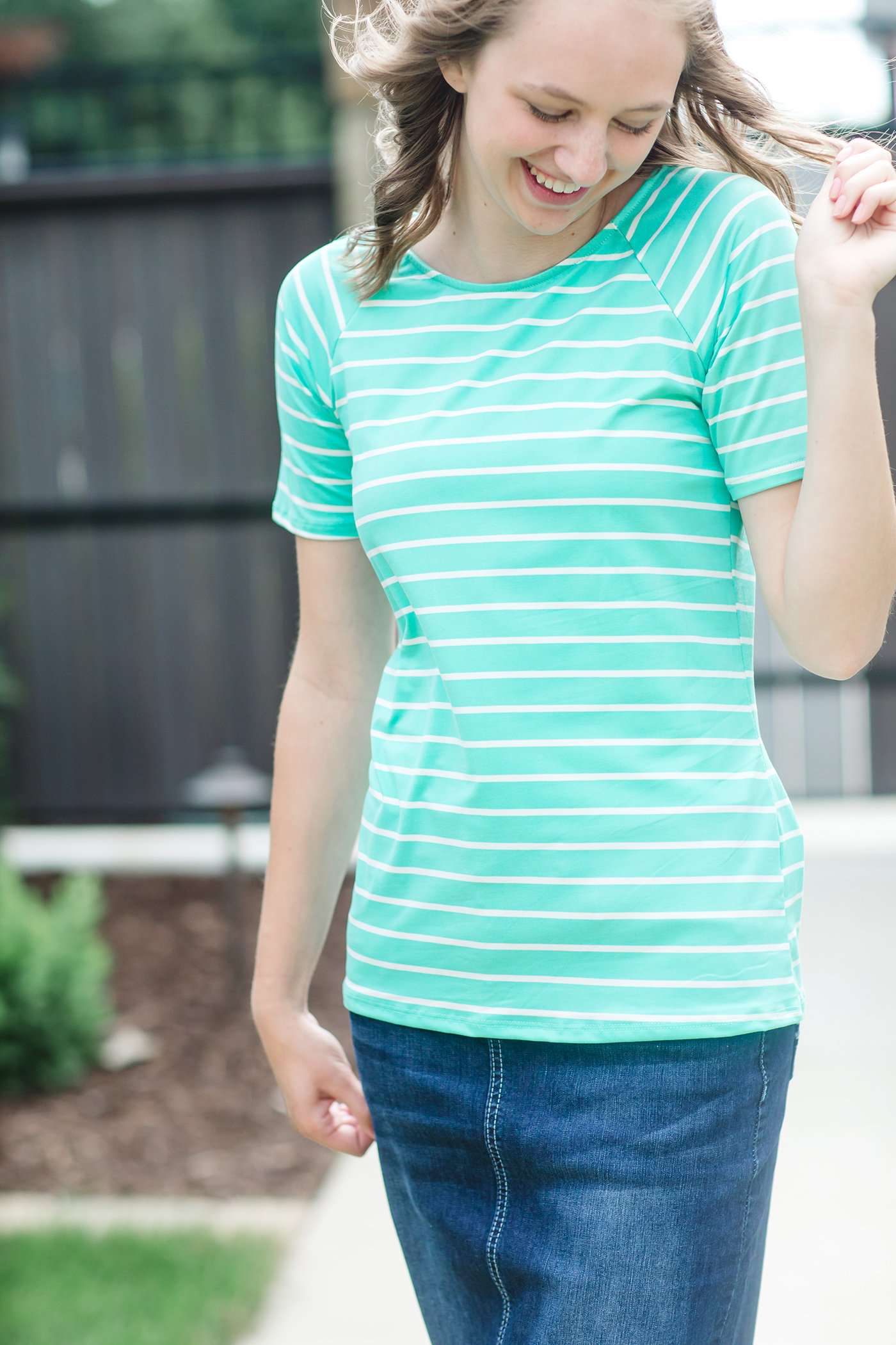 Modest boat-neck and raglan sleeve tee in mauve or teal with white horizontal stripes.