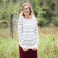 Ivory with thin black striped boatneck long-sleeve shirt.