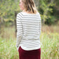 Ivory with thin black striped boatneck long-sleeve shirt.